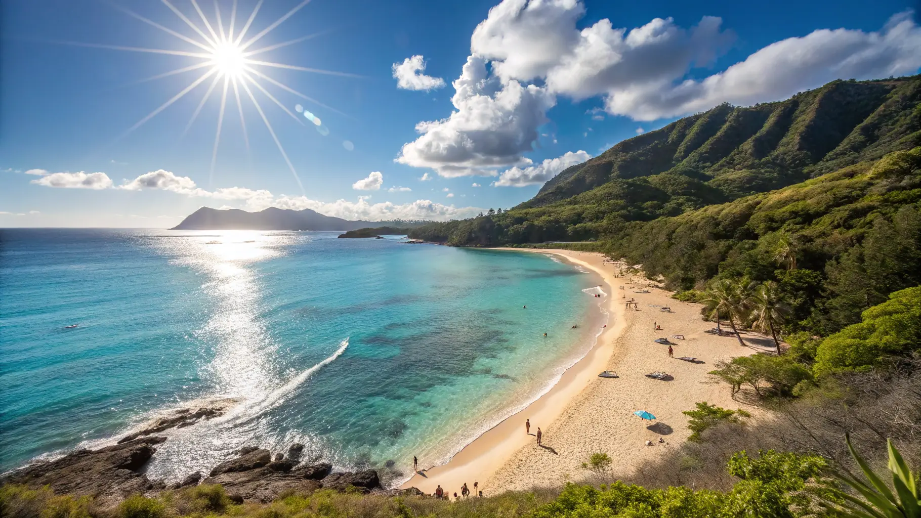 A scenic view of the Hawaiian coastline with lush green mountains in the background and clear blue water in the foreground. The sun is shining brightly, creating a vibrant and inviting atmosphere.